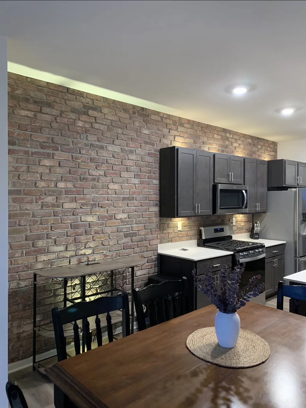 Interior exposed brick accent wall masonry in a modern kitchen, Lakemoor IL